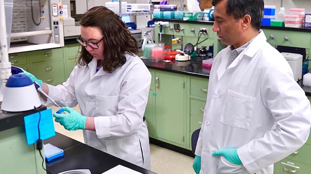 Erin Andres and M. Hashim Raza in the genetics laboratory